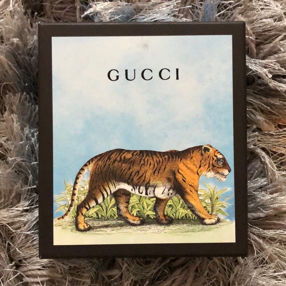 Gucci billfold crafted of navy and red and white